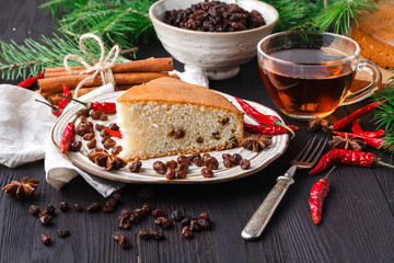 Stollen is a Traditional German Cake with raisins on a light knitted background.Gift for Christmas