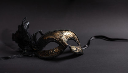 Carnival mask with feathers  on black background