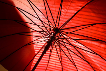 Inside red umbrella and sunlight with shadow, Sunshine through parasol.