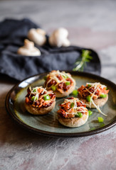 Roasted mushrooms stuffed with ham, sun dried tomato and bell pepper