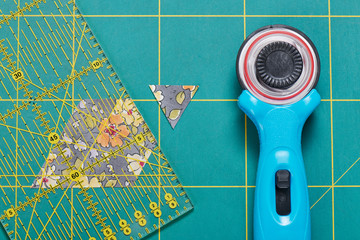 The process of cutting pieces of fabric in the shape of hexagons to create a quilt
