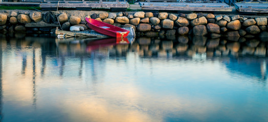 Fototapeta na wymiar small red boat at a harbor