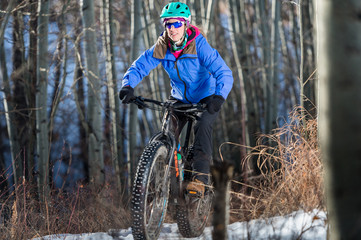 Woman Riding a Fatbike in the Snow