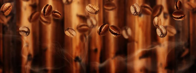 Foto op Aluminium Flying coffee beans in front of dark brown wood, banner © fotoknips