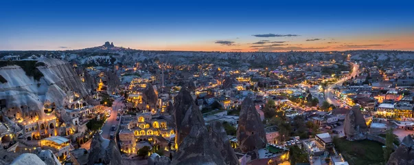 Zelfklevend Fotobehang Evening panorama of the village of Goreme, Turkey, Cappadocia © Nataliia Vyshneva