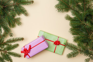 Christmas tree and gifts on wooned background.