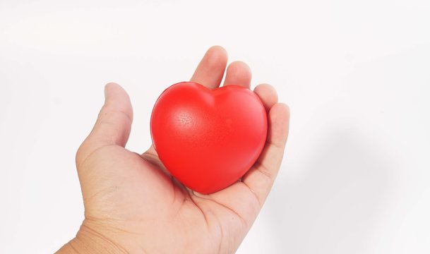 Hand holding a heart shape.