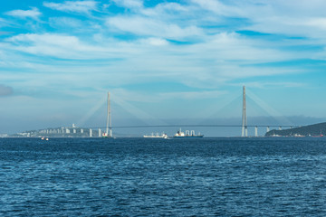 Fototapeta na wymiar seascape with Russian bridge on the horizon.