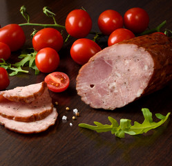 Smoked sausage with vegetables: tomatoes, lamb's lettuce