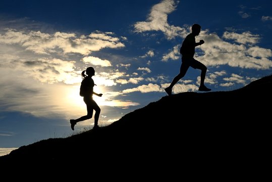 Hikers, Trail running on the Eggenalm, back light, Reit im Winkl, Upper Bavaria, Bavaria, Germany, Europe