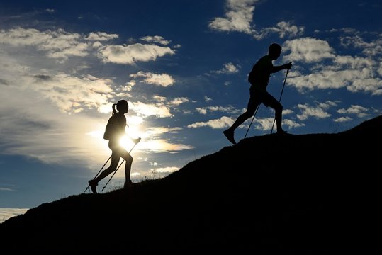 Hikers, Trail running on the Eggenalm, back light, Reit im Winkl, Upper Bavaria, Bavaria, Germany, Europe