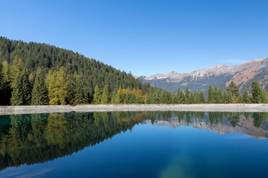 Water reservoir for snow production for the ski slopes on Grubigstein with view to Daniel, Lermoos, Tyrol, Austria, Europe