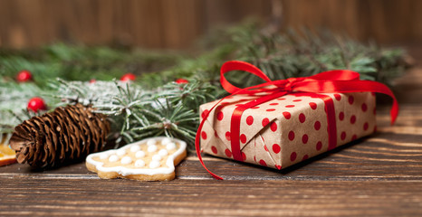 Christmas fir tree with decoration on a wooden board. Copy-space for text
