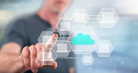 Man touching a cloud computing concept