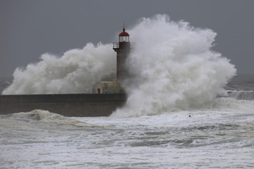 Big storm with big waves near a lighthouse - 235006323