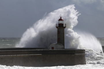 Big storm with big waves near a lighthouse - 235006355