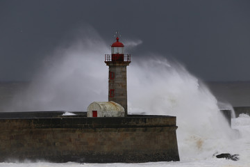 Big storm with big waves near a lighthouse - 235006503