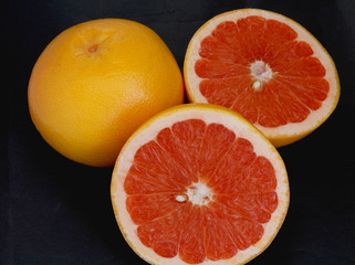 citrus fruits on wooden background close up
