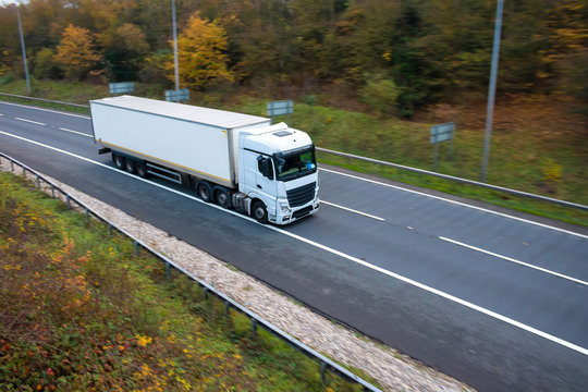 White Articulated Lorry On The Road