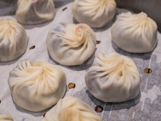 Close up shot of a Chinese style red bean Xiao Long Bao