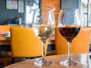 Close up shot of a glass of red wine and white wine