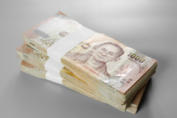 Thai baht banknote. Business and Finance concept. Bulk of banknote on white background.