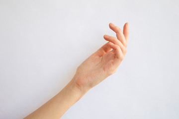 Young woman hand isolated on white.