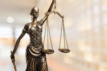 Justice Scales and books and wooden gavel on table. Justice
