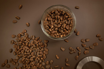 Crude pine nuts on brown background top view. Organic and healthy food.