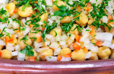 Tray of cooked chickpeas salad with onions