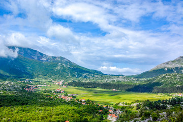 Fototapeta na wymiar The Kotor bay is the notable landmark, that boasts beautiful landscapes, cozy beaches and medieval architecture of its old towns and villages, Montenegro.