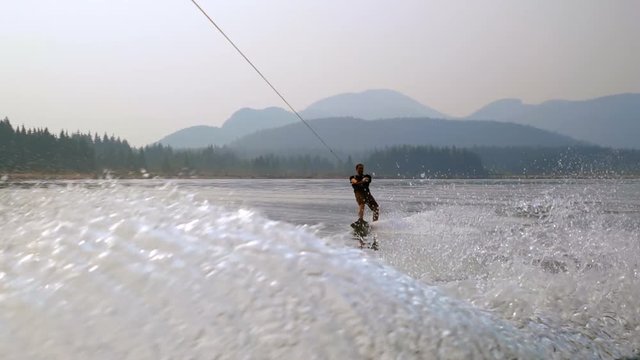 Man wakeboarding in the river 4k