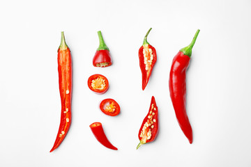 Fresh red chili peppers on white background, top view