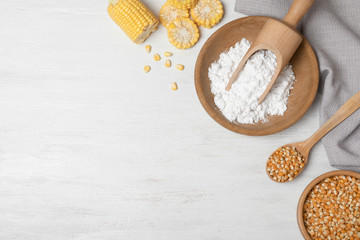 Flat lay composition with corn starch and space for text on white wooden background