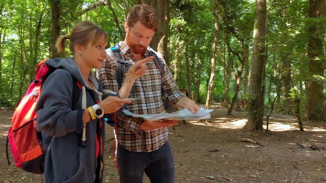 Couple discussing map in boot camp 4k