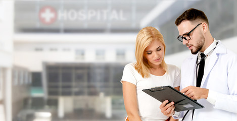 Doctor talking to patient in the hospital.