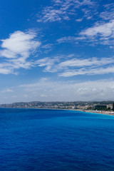 Naklejka na ściany i meble Buildings and beaches next to blue sea in the city of Nice, France