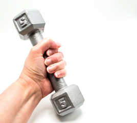 Caucasian female hand with dumbbell isolated on white