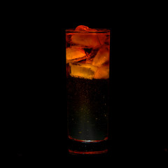 Orange Sparkling iced alcohol drink with isolated black background