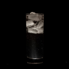 Sparkling iced alcohol drink with isolated black background