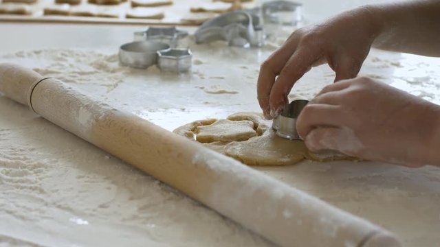 Close Up Shot Of Child Hand Using Cookie Cutters