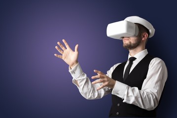 Businessman with white vr glasses in an empty room with no wallpaper
