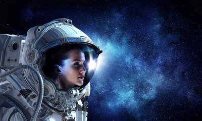 Attractive woman in spacesuit - Powered by Adobe