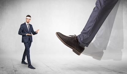 Big foot trample young suited karate man
