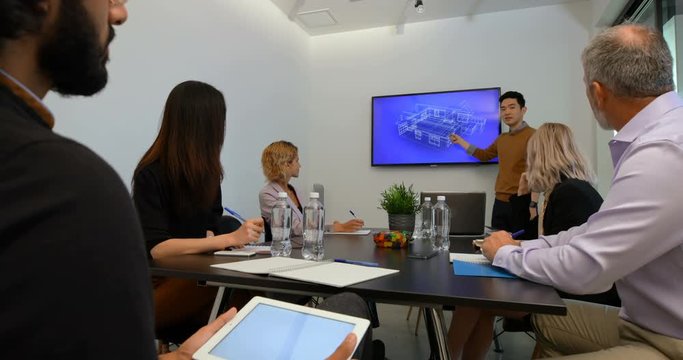 Businessman giving presentation in conference room 4k