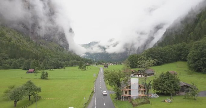 4K - Following Car with Drone in Lauterbrunne in Switzerland - Mountain and Clouds