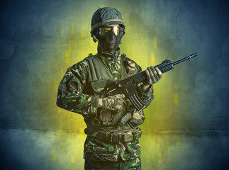 Hazard, menace soldier in a ruined crumbly building with arms on his hand
