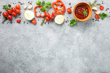 Homemade sauce adjika with pepper, garlic, tomatoes and parsley. Top view. Copy space