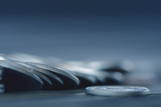 Row of coins on wood background for finance and Saving concept,Investment, Economy, Soft focus and dark style.