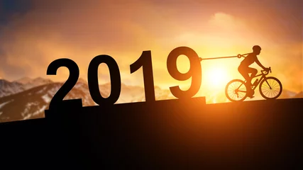 Lichtdoorlatende gordijnen Fietsen silhouette bicycle pull 2019 Text to sunset mountain background in Happy New Year Concept